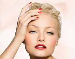 Blonde haired woman with red nails